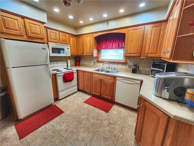 1013 Charles Dr, Union Twp Law, PA 16101 - kitchen with white appliances, a sink, brown cabinetry, decorative backsplash, and light countertops