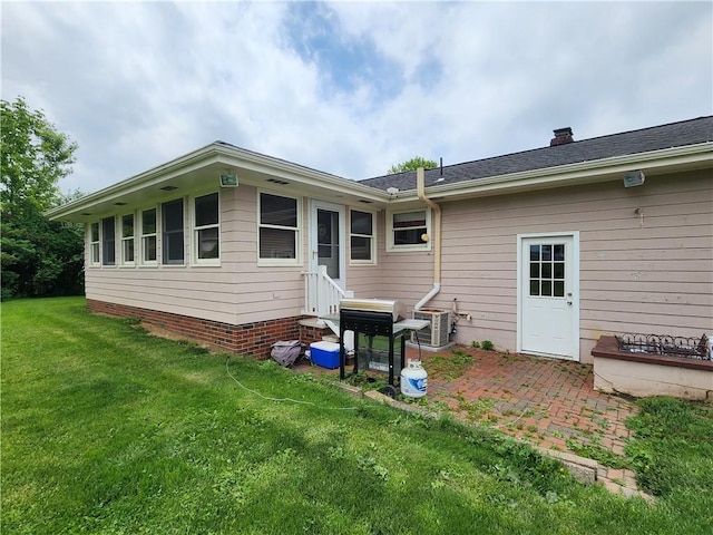 1013 Charles Dr, Union Twp Law, PA 16101 - rear view of property featuring a lawn, entry steps, and central air condition unit