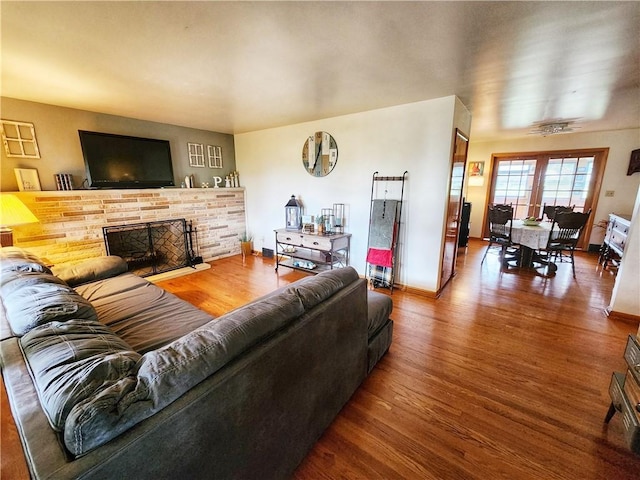 1013 Charles Dr, Union Twp Law, PA 16101 - living room with a brick fireplace, wood finished floors, baseboards, and ceiling fan