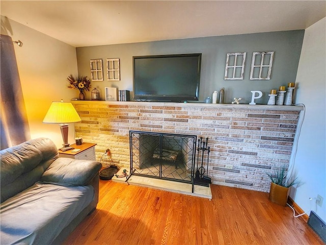 1013 Charles Dr, Union Twp Law, PA 16101 - living room with wood finished floors and a brick fireplace