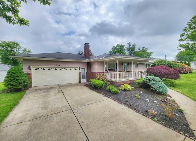 1013 Charles Dr, Union Twp Law, PA 16101 - ranch-style home with brick siding, covered porch, driveway, and a garage