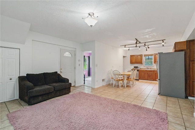 2883 Wilson St N, Franklin Twp, PA 15301 - living room featuring light tile patterned floors and rail lighting