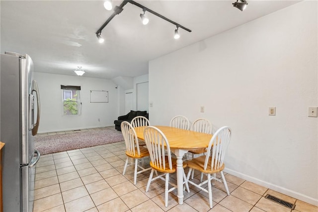 2883 Wilson St N, Franklin Twp, PA 15301 - dining area featuring light tile patterned flooring, baseboards, and rail lighting