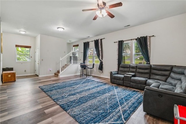 2883 Wilson St N, Franklin Twp, PA 15301 - living room with stairway, a ceiling fan, wood finished floors, and baseboards