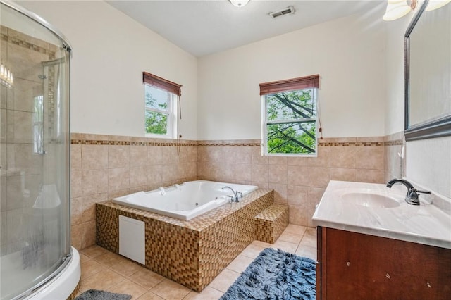 2883 Wilson St N, Franklin Twp, PA 15301 - full bath featuring plenty of natural light, tile patterned floors, tile walls, a stall shower, and a jetted tub