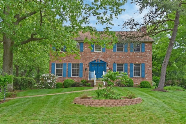 412 Forest Trails Dr, Mccandless, PA 15090 - colonial home with brick siding, a front yard, and a chimney
