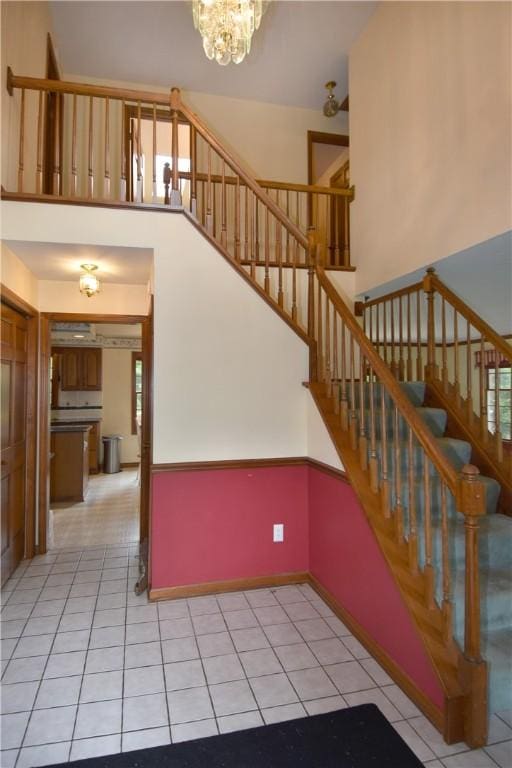 412 Forest Trails Dr, Mccandless, PA 15090 - stairs featuring a chandelier, tile patterned floors, and a towering ceiling