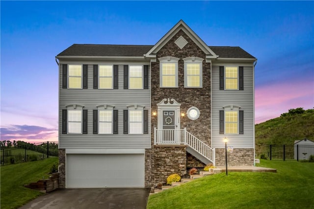 136 Azalea Cir, Belle Vernon Wml, PA 15012 - view of front of house with stone siding, an attached garage, and driveway