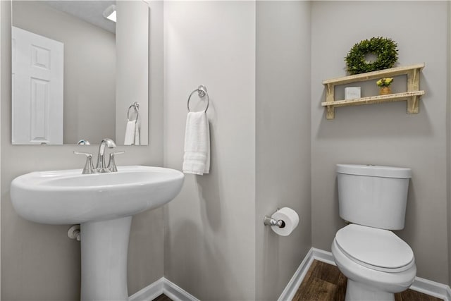 136 Azalea Cir, Belle Vernon Wml, PA 15012 - half bathroom featuring toilet, baseboards, wood finished floors, and a sink
