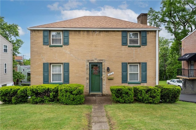 922 Bower Hill Rd, Mt Lebanon, PA 15243 - view of front of house with a chimney, a front lawn, and brick siding