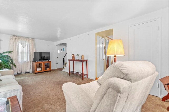 922 Bower Hill Rd, Mt Lebanon, PA 15243 - carpeted living room featuring stairway and arched walkways