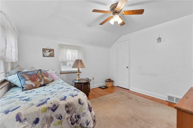 922 Bower Hill Rd, Mt Lebanon, PA 15243 - bedroom featuring wood finished floors, multiple windows, lofted ceiling, and a ceiling fan
