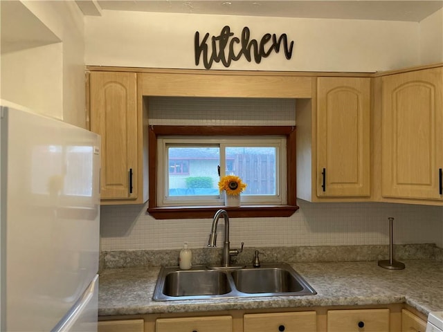 309 Delaware N, Versailles, PA 15137 - kitchen featuring fridge, a sink, and light brown cabinets