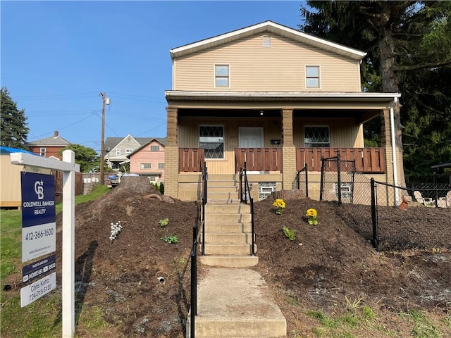 309 Delaware N, Versailles, PA 15137 - view of front of property with covered porch and brick siding