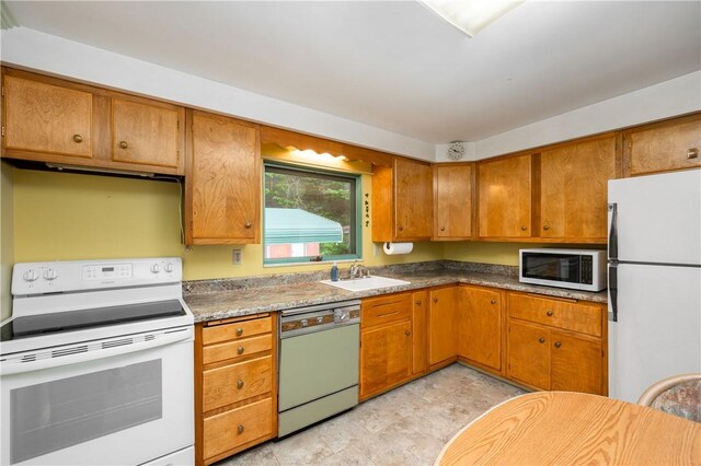 541 W Danville Rd, Oakland Twp, PA 16025 - kitchen with white appliances, a sink, and brown cabinets