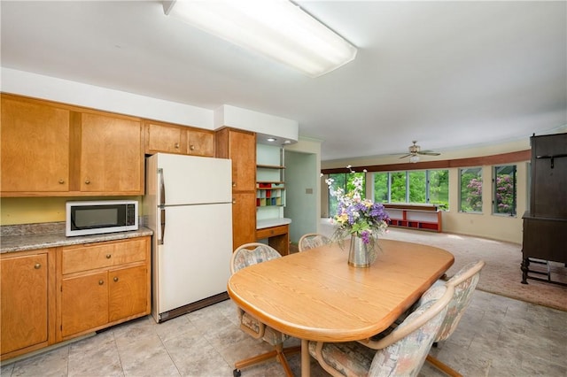 541 W Danville Rd, Oakland Twp, PA 16025 - dining area with ceiling fan and stone finish floors