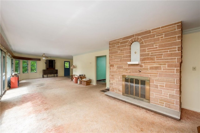 541 W Danville Rd, Oakland Twp, PA 16025 - unfurnished living room featuring a stone fireplace, carpet, a ceiling fan, and ornamental molding