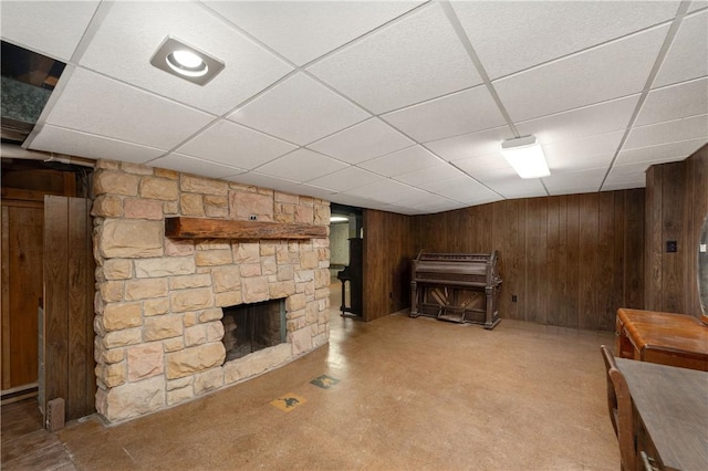 541 W Danville Rd, Oakland Twp, PA 16025 - finished below grade area featuring a stone fireplace, a paneled ceiling, and wood walls