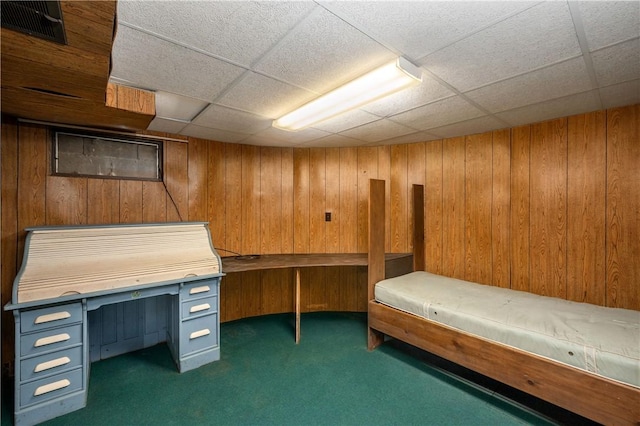 541 W Danville Rd, Oakland Twp, PA 16025 - unfurnished bedroom featuring a drop ceiling, wooden walls, and carpet flooring