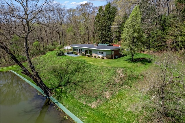 541 W Danville Rd, Oakland Twp, PA 16025 - rear view of property featuring a wooded view, a lawn, and a water view