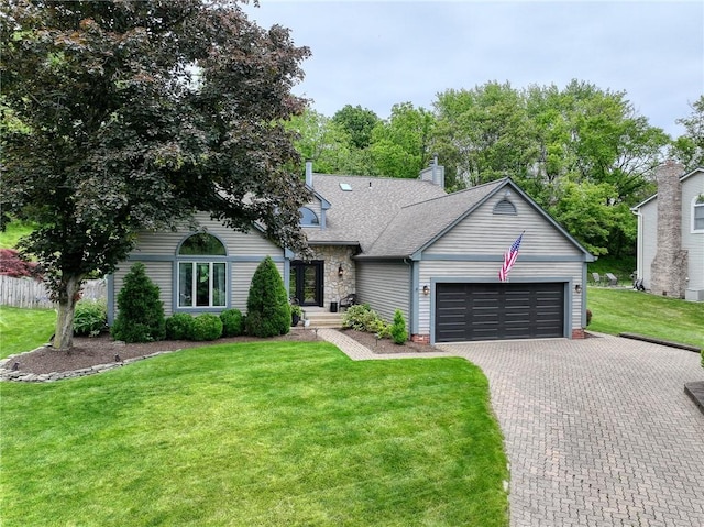 272 Lynn Ann Dr, Plum Boro, PA 15068 - ranch-style home with a garage, a front lawn, driveway, a shingled roof, and stone siding