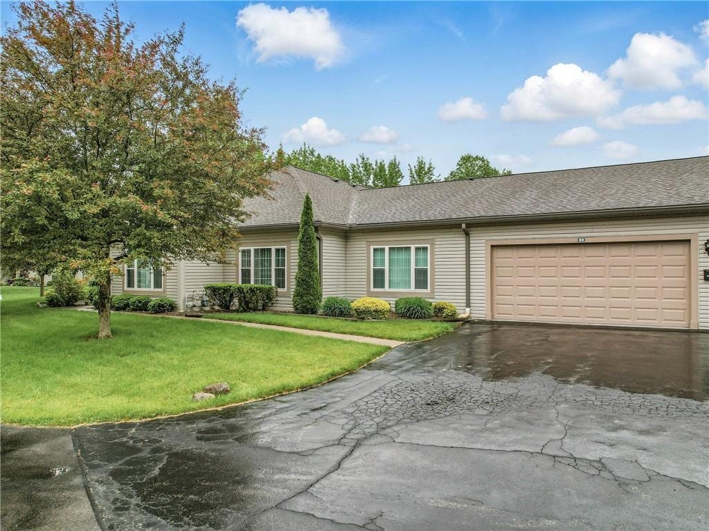 60 Stone Ridge Blvd, Hermitage, PA 16148 - ranch-style house featuring asphalt driveway, a front yard, an attached garage, and roof with shingles
