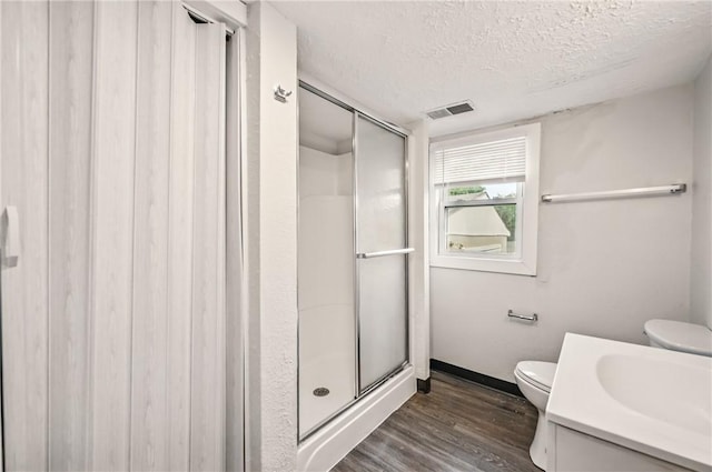 256 Marshall St, Hermitage, PA 16148 - full bath featuring a textured ceiling, toilet, wood finished floors, a shower stall, and vanity