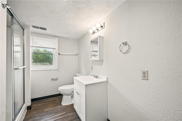 256 Marshall St, Hermitage, PA 16148 - full bath with a textured ceiling, wood finished floors, vanity, toilet, and an enclosed shower