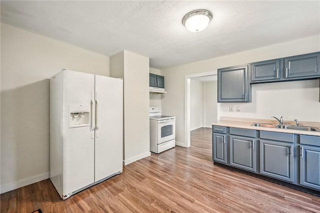 256 Marshall St, Hermitage, PA 16148 - kitchen featuring white appliances, a sink, light wood-style floors, and baseboards