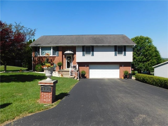 403 Shannon Dr, South Union Twp, PA 15401 - bi-level home with asphalt driveway, a garage, brick siding, and a front yard