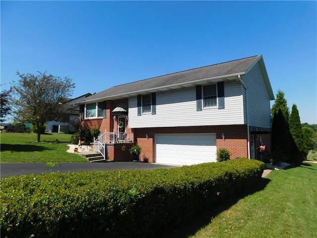 403 Shannon Dr, South Union Twp, PA 15401 - bi-level home with brick siding, a garage, and a front lawn