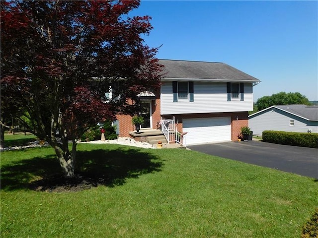 403 Shannon Dr, South Union Twp, PA 15401 - view of front of home with asphalt driveway, a garage, a front yard, and brick siding