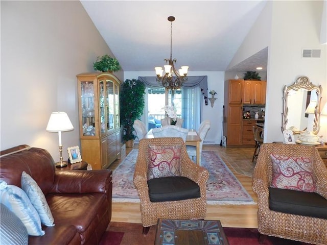403 Shannon Dr, South Union Twp, PA 15401 - living room featuring a chandelier, high vaulted ceiling, and wood finished floors