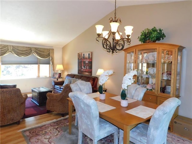 403 Shannon Dr, South Union Twp, PA 15401 - dining space featuring a chandelier, lofted ceiling, and wood finished floors