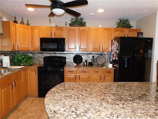 403 Shannon Dr, South Union Twp, PA 15401 - kitchen featuring black appliances, light stone countertops, tasteful backsplash, ceiling fan, and recessed lighting