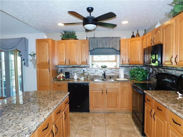 403 Shannon Dr, South Union Twp, PA 15401 - kitchen featuring black appliances, a sink, light stone counters, tasteful backsplash, and recessed lighting