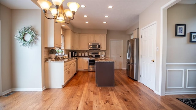 104 Cherokee Ct, Buffalo Twp But, PA 16229 - kitchen featuring appliances with stainless steel finishes, a kitchen island, recessed lighting, a chandelier, and light wood-style flooring