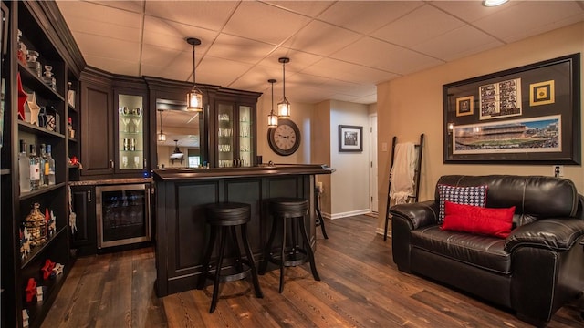 104 Cherokee Ct, Buffalo Twp But, PA 16229 - indoor wet bar featuring wine cooler, dark wood-style floors, hanging light fixtures, baseboards, and a drop ceiling