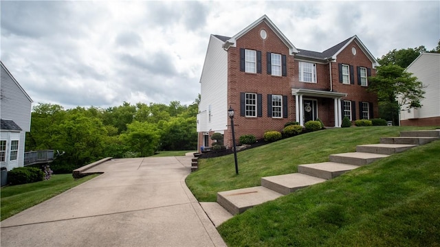 104 Cherokee Ct, Buffalo Twp But, PA 16229 - view of front facade with brick siding and a front lawn