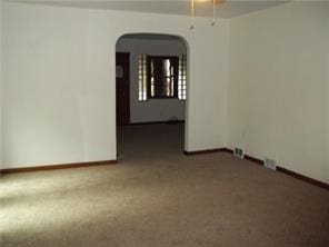 1545 Cooper Ave, Brighton Heights, PA 15212 - spare room featuring arched walkways, carpet flooring, and baseboards