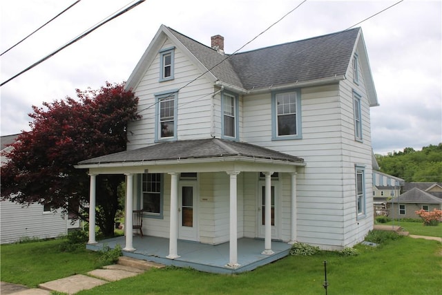 339 W Ross St, Worthington, PA 16262 - view of front of property with a porch, a shingled roof, and a front lawn