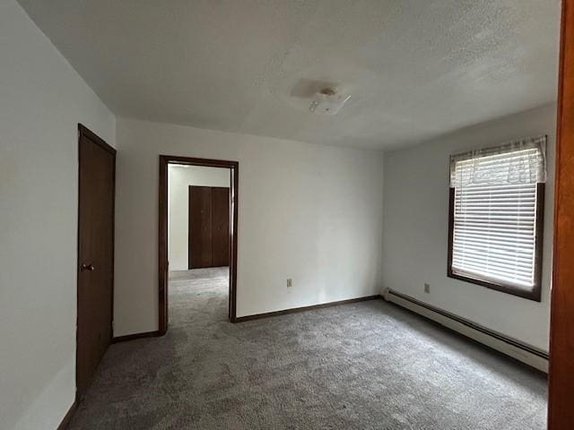 735 Park Ave, Johnstown, PA 15902 - carpeted empty room featuring a baseboard heating unit and baseboards