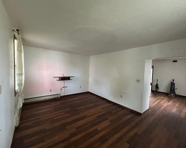 735 Park Ave, Johnstown, PA 15902 - unfurnished room featuring a baseboard radiator and wood finished floors
