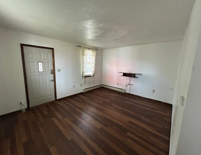 735 Park Ave, Johnstown, PA 15902 - foyer entrance with wood finished floors and a baseboard heating unit