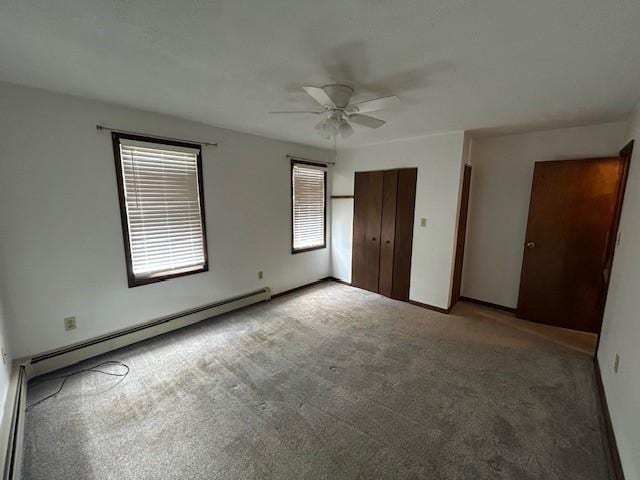 735 Park Ave, Johnstown, PA 15902 - unfurnished bedroom with baseboard heating, carpet, and ceiling fan