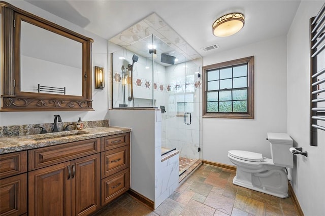 2465 Citation Ct, Franklin Park, PA 15090 - bathroom featuring baseboards, a towel warmer, toilet, and stone tile flooring