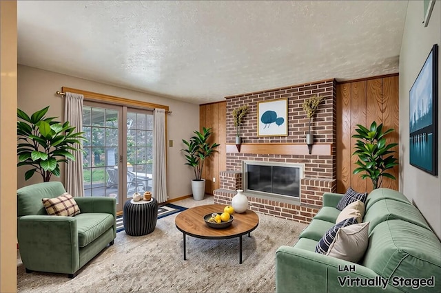 18 Giant Oak, Baden, PA 15005 - living room featuring a brick fireplace, a textured ceiling, and baseboards