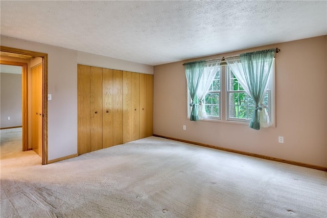 18 Giant Oak, Baden, PA 15005 - unfurnished bedroom featuring carpet floors, a closet, a textured ceiling, and baseboards