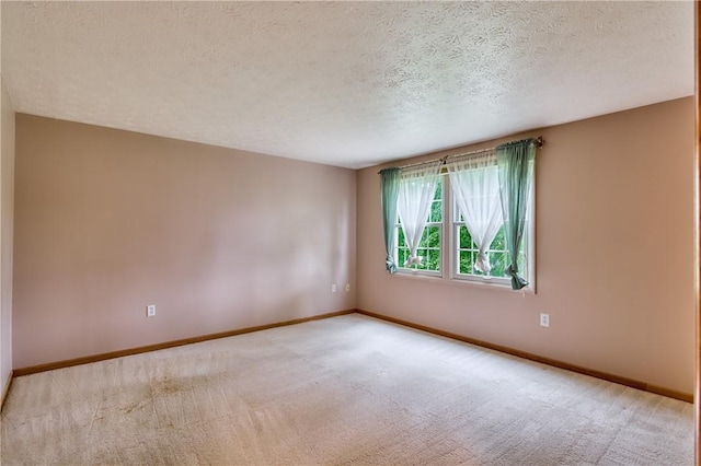 18 Giant Oak, Baden, PA 15005 - spare room with a textured ceiling, carpet flooring, and baseboards