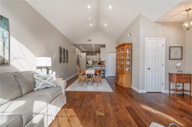 139 Canter Ln, West Deer, PA 15044 - living area featuring dark wood-style floors, baseboards, high vaulted ceiling, a chandelier, and recessed lighting